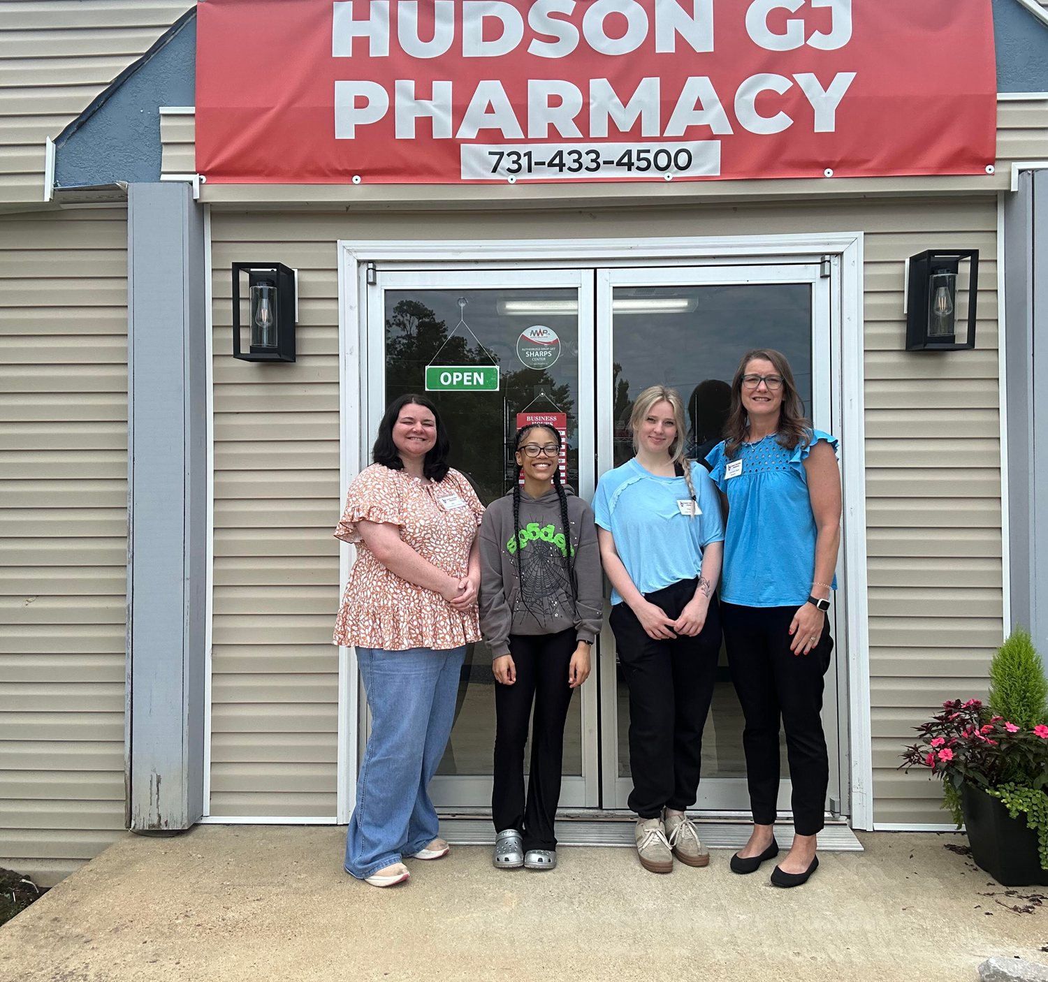 The Hudson Grand Junction Pharmacy team in front of the store