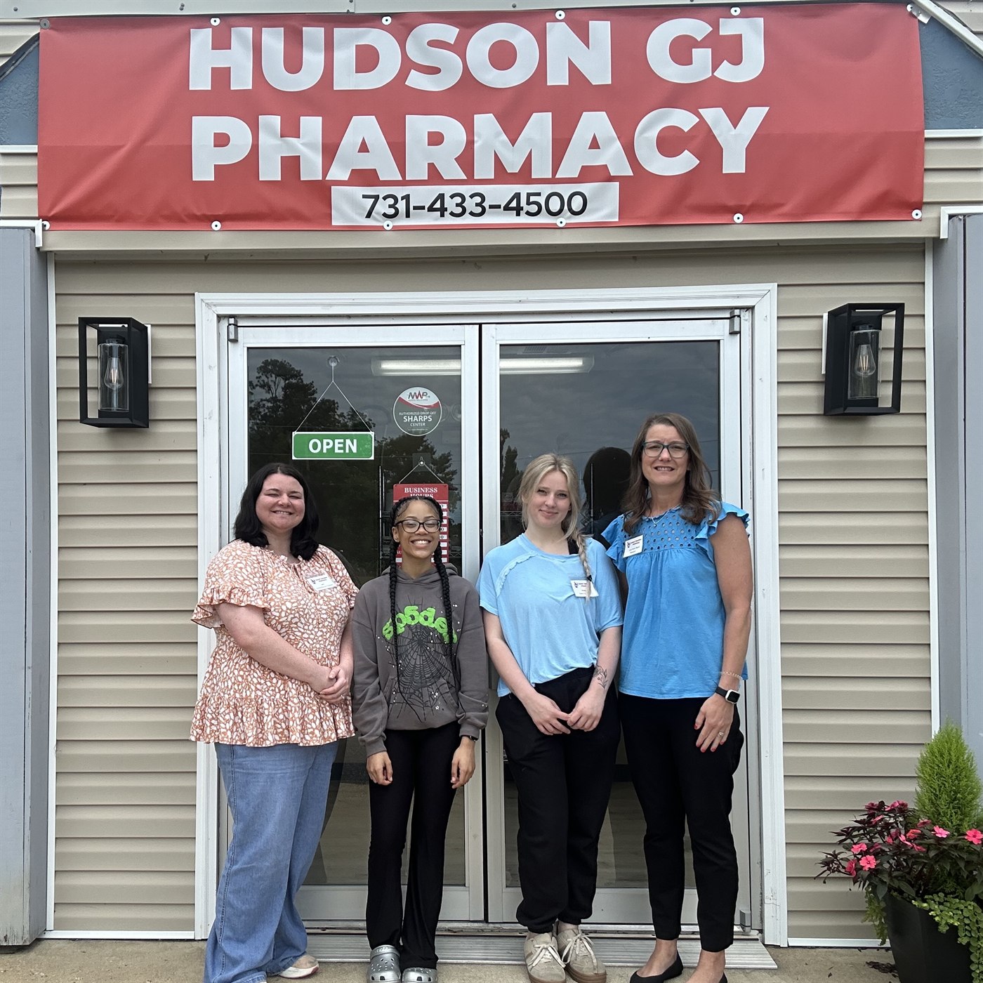 The Hudson Grand Junction Pharmacy team in front of the store